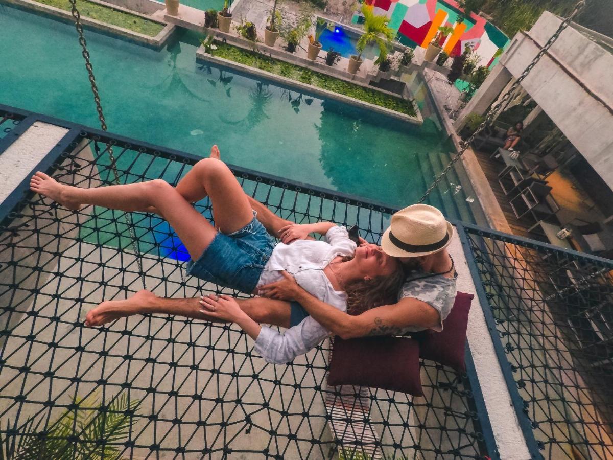 Hotel Makaabá Eco-Boutique Bacalar Exterior foto A couple on a hammock